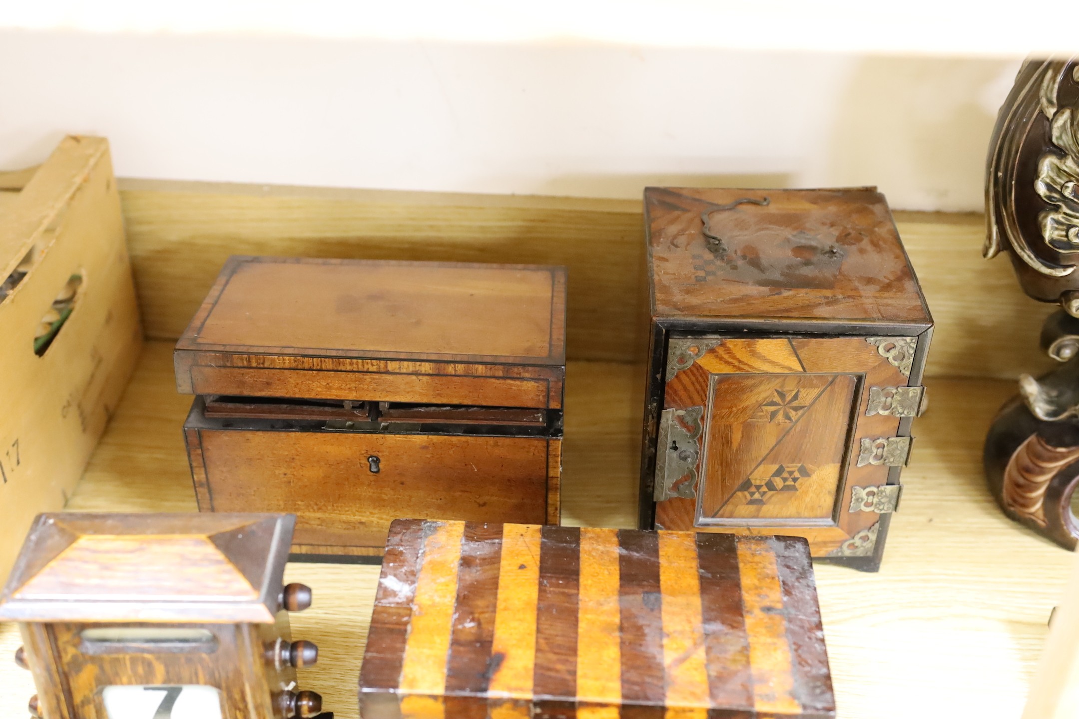 Three 19th century inlaid mahogany tea caddies, a Hakone ware cabinet and assorted treen etc.